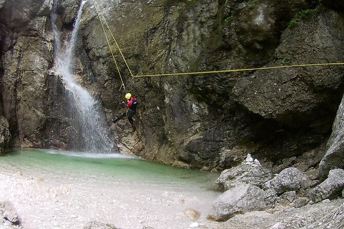 Canyoning In The Triglav National Park - The 50-meter waterfall rappel