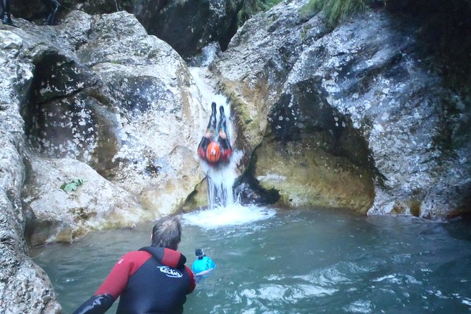 Family Canyoning In Soca Valley - Jumping and sliding through the first section