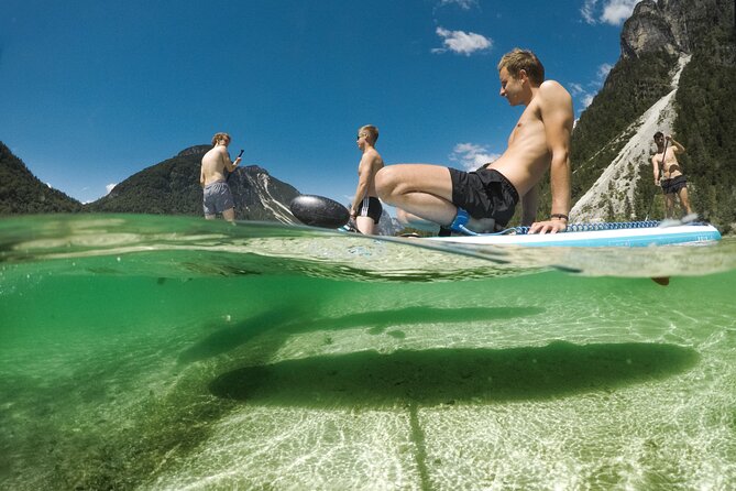 Half Day Stand-up Paddle Boarding (SUP) trip on Lake Predil - The first lesson: knees first, standing later