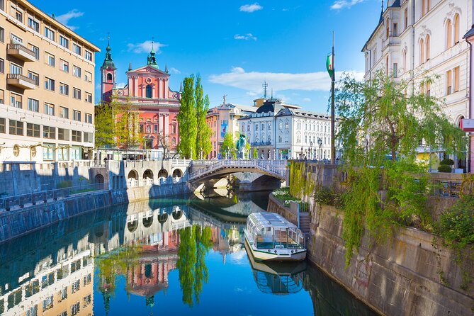 Ljubljana boat cruise and walking tour - Dragon Bridge and the path to the Ljubljanica
