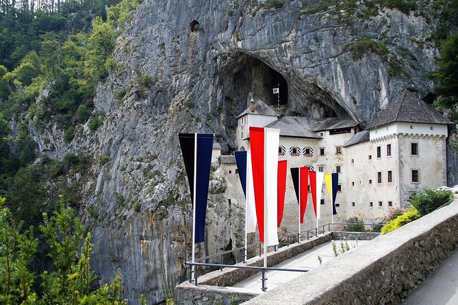 Postojna Cave with Train Ride and Predjama Castle Half Day Trip from Ljubljana - A castle built into a 123-meter cliff