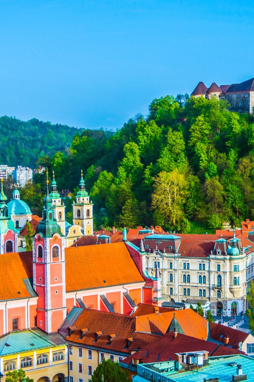 Zagreb: Postojna Cave, Predjama Castle & Ljubljana in a Day - Predjama Castle and its cliffside setting